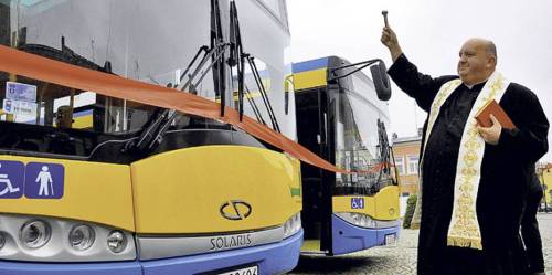 Polish priest blessing new buses. Skierniewice, 2010.