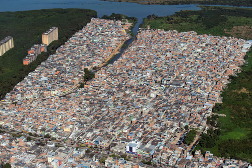 Aerial view of Rio das Pedras shantytown (favela), next to Barra da Tijuca, in Rio de Janeiro, Brazi