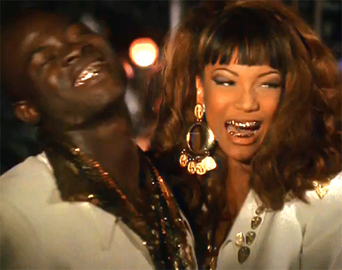 evilrashida: Djimon Hounsou and Tyra Banks wearing Thierry Mugler Spring/Summer 1992 in George Micha