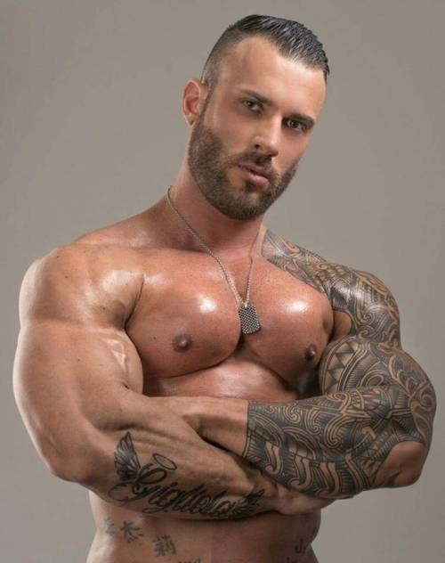 A dream of a man - exceptional pecs, awesome ink work, and he is just dam handsome & sexy - WOOF