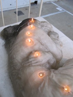showslow:  A.F Vandevorst have sculpted a life-size sculpture of a sleeping girl in 250kg of candle wax. Over the one month course of the Arnhem Mode Biennale 2011, the candle burnt down day by day, melting and transforming throughout the duration of