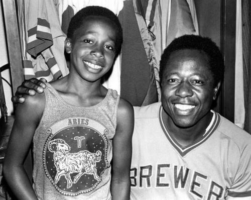 blondebrainpower:  MC Hammer and Hammerin’ Hank Aaron 1975Stanley Burrell poses with slugger Hank Aaron in the Milwaukee Brewer dressing room. Stanley later known as MC Hammer was working as a Oakland A’s “clubhouse” boy and the players nicknamed