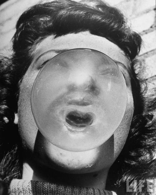 Porn photo Cornell Capa - Close-up of girl blowing bubble