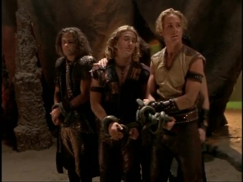 Young Hercules E21Hercules (Ryan Gosling), Iolaus (Dean O’Gorman) and friend bound and kneeling.