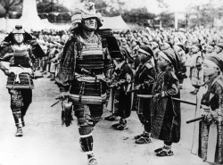 rtrixie:  Younger and older samurais at a pageant in Japan, between the two World Wars, circa 1930. (Photo by Hulton Archive/Getty Images) 