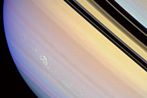 astronomyblog:  Saturn’s atmosphere exhibits a banded pattern similar to Jupiter’s, but Saturn’s bands are much fainter and are much wider near the equator. The nomenclature used to describe these bands is the same as on Jupiter. Saturn’s finer