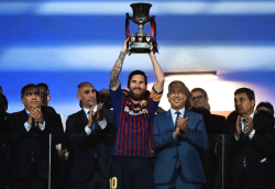 teammessi:  Barcelona’s Argentinian forward Lionel Messi carries the cup at the end of the Spanish Super Cup final between Sevilla FC and FC Barcelona at Ibn Batouta Stadium in the Moroccan city of Tangiers on August 12, 2018.