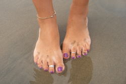 tastemyfeet:  feet in the dark sand!!!!!