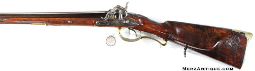 A percussion muzzleloading .58 caliber rifle/20 gauge shotgun combo, German, 19th century.For sale b