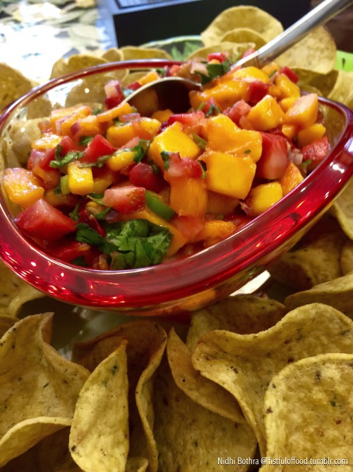 Strawberry-Mango Salsa with baked kale, carrot and spinach chips.