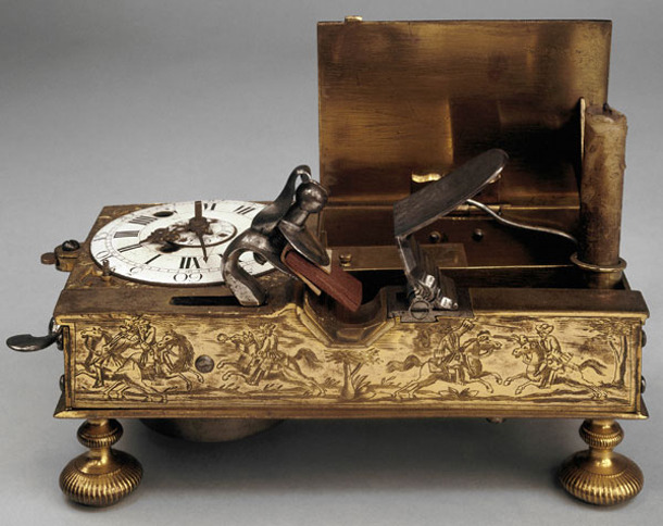 peashooter85:  Mechanical alarm clock with flintlock candle lighting mechanism. 