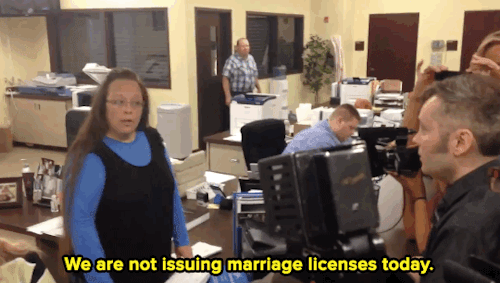 psyducked:

micdotcom:

micdotcom:


Kentucky clerk continues to ignore the Supreme Court’s same-sex marriage order 
Kim Davis, a Kentucky county clerk who made headlines earlier this year for her refusal to follow the Supreme Court decision legalizing same-sex marriages, has vowed to continue her fight despite a Monday court decision denying her request for an appeal. Her refusal was caught on video Tuesday — as passionate protests rang outside her office.

UPDATE: Davis has been taken into custody for refusing to issue marriage licenses. The judge said Davis would be jailed for ignoring a Monday Supreme Court order that she start issuing licenses, something she stopped doing for all couples in June. This is a developing story. 