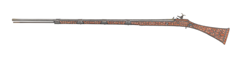 A lovely miquelet musket decorated with red coral.  Originates from Algeria, signed work of “Mustafa