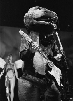 nirvananews:  Kurt Cobain dressed as Barney the Dinosaur during a live Halloween show in Akron, Ohio, 1993. Special Thanks to photographer: Jay Brown. 