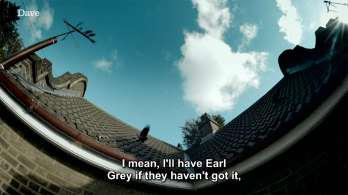 [ID: Four screencaps from Taskmaster, looking up at the blue sky and birds flapping around on the ro