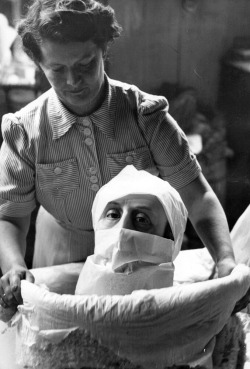  John Chillingworth - A wax head being packed up for despatch at a factory which specialises in near-life models for shop windows, museums and exhibitions, 1950. 