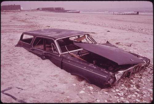 meschkinnes:  Sand Covers Abandoned Car on Beach at Breezy Point South of Jamaica Bay, 1973  