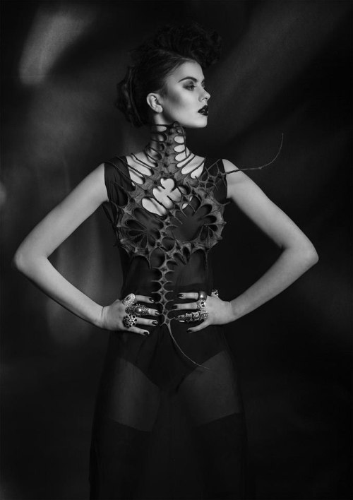 fetishmode:Nika Danielska Designs Macabre in style and sharp in design, these fetish fashion designs by Nika Danielska feature skeletal cages that constrict and contort the body for the sake of fashion. Face masks, neck braces and shoulder spikes make