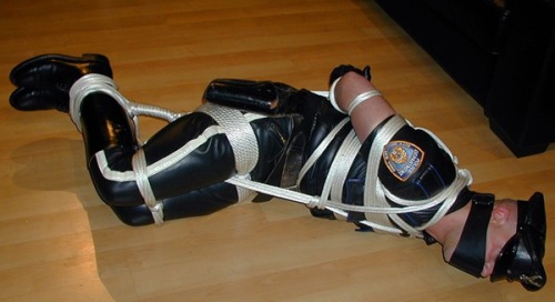 bondageforthebigman: bootsbound: Taking down big beefy booted cops is great.  White ropes go we