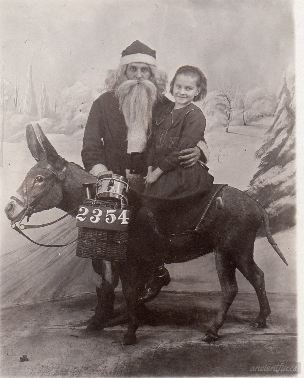 ancientfaces:  Christmas with Santa Claus in 1922 Not much information is known about