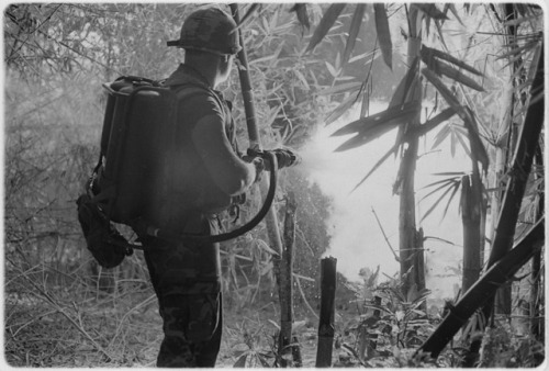 A US soldier firing a flamethrower during the Vietnam War.