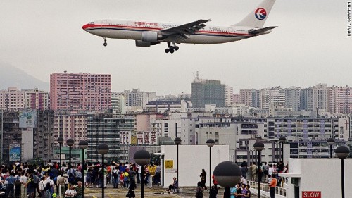 brittq:  Pictures of the former Kai Tak International Airport in Hong Kong (closed since 1998), taken by aviation photographer Daryl Chapman. The airport was located within the city, producing what has to be the most thrilling plane landing and viewing