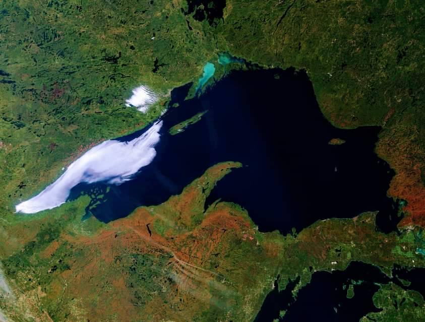 Satellite image of Lake Superior with some of the surrounding land colored orange