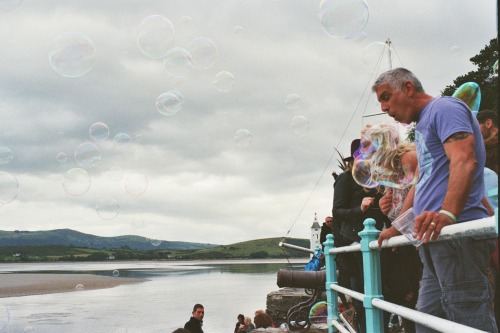 Blowing bubbles.