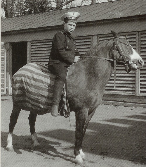 Tsarevich Alexei Nikolaevich Romanov riding a horse.