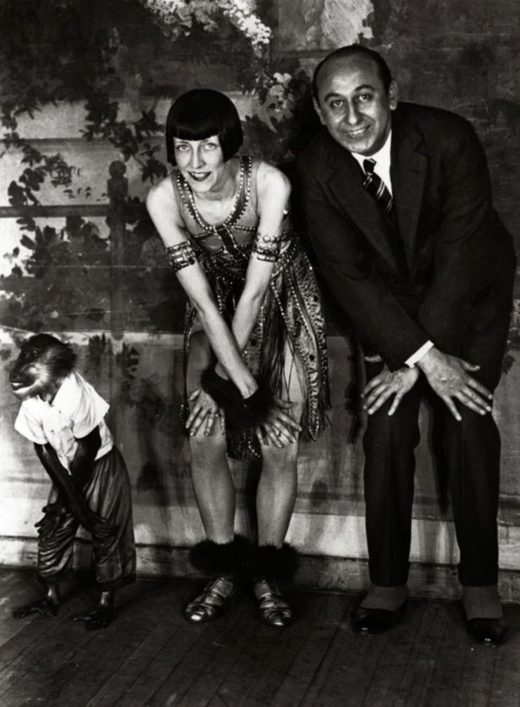 A monkey doing the &lsquo;Charleston&rsquo; alongside a couple of dancers,