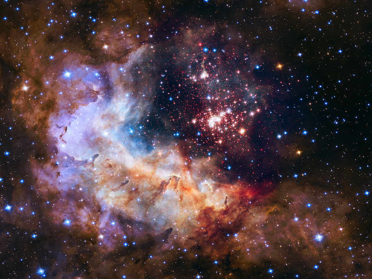 just–space: Celestial Fireworks : The brilliant tapestry of young stars flaring