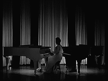 classicladiesofcolor:  The incomparable Hazel Scott playing two grand pianos in The Heat’s On (1943) [x] 