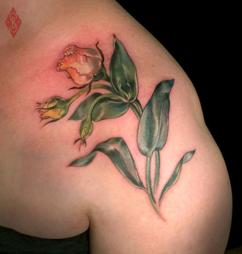 Lisianthus flower on shoulder and chest - this was a piece from a larger bouquet in the shop that co