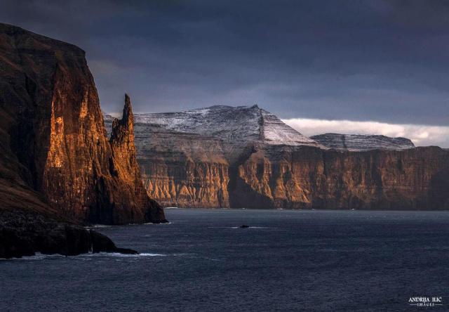 Last bit of sunshine on Trøllkonufingur (the Witchs Finger) sea stack in Faroe Islands [1080x750] [OC] IG @andrija_ilic_images #earth#images#earth pictures #I love earth  #earth is awesome