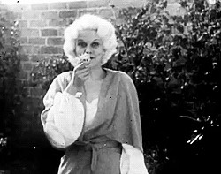  Jean Harlow fooling around in a garden and later, with her acting coach, 1931.  
