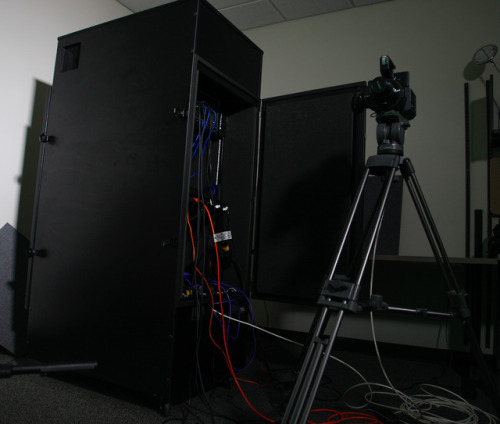 Our new streaming room is coming along; door is on, greenscreen is up, a whole mess of new gear is g