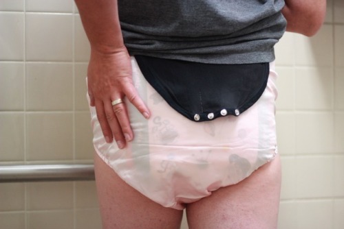 Diapered for work with a little extra sissy flair today. Satin snappie diaper cover by The Dotty Dia