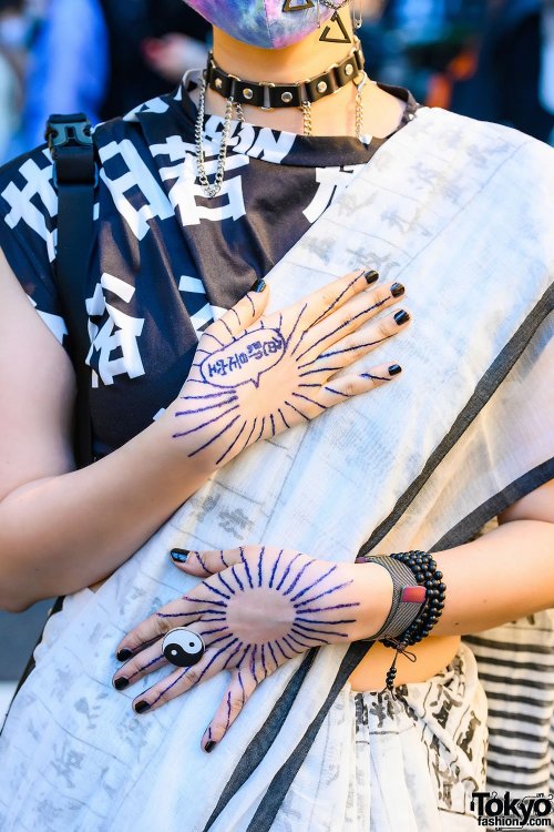 Japanese PHD neuroscience student Yoritam (she/they) on the street in Harajuku wearing a kanji print