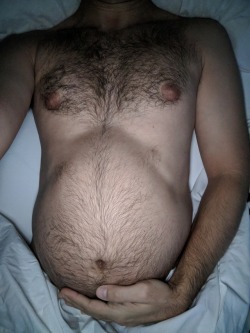 excuseme5s:Woke up with a bigger belly, and it made me hard. Couldn’t wait til he got home so he could pin me down again and pound some more sperm into me. Love getting barebacked.