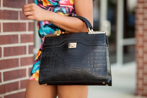 She had the handbag of someone who camps out and seldom goes home, or who imagines life must be full