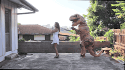 gifsboom:  Teaching A T-Rex to Macarena.