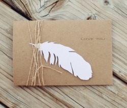 united-arrow:  paper feather and twine on