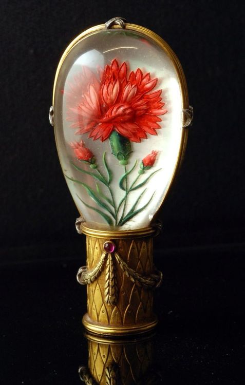 &ldquo;Essex crystal&rdquo; cane handle. Back-carved and painted rock crystal set in gold ba