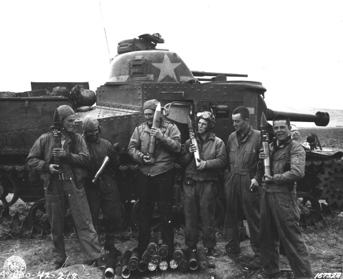 The crew of an American M3 Lee medium tank pose with ammunition outside their vehicle. Souk el Arba,