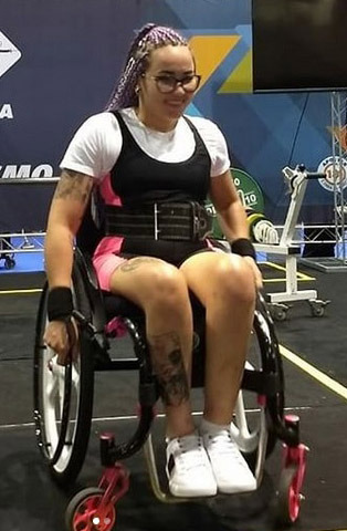 Paralyzed power lifter in her wheelchair with nice hair braids