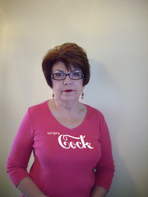 Sandy Is Wearing An Undersized Pink Top That Is Being Stretched By Her 36DD Tits. She Is Also Advertising