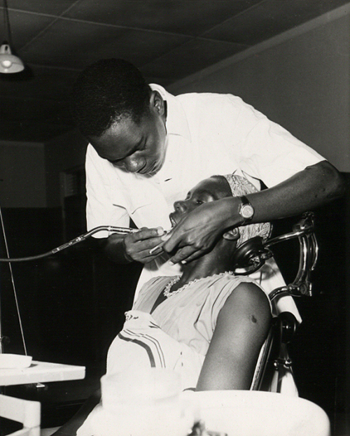 A Dental Assistant attends a patient at the Dental Unit, Princess Margaret Hospital, Dar es Salaam, 