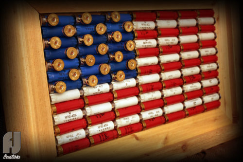 gunrunnerhell:  Shotgun Shell FlagCustom made to order decorative American flag made of red, white and blue shotgun shells by FJ Creations. I’m not 100% sure they still make these but you can contact them in the link below to check. (GRH)Source