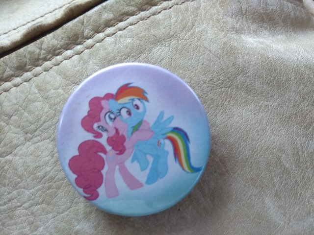 I found this brooch on vacation.Before I had found one of rarity but then I saw this and I had to take it! And now i have a PinkieDash brooch on my backpack and i love it(shipping-is-my-job)this is my favorite pinkiedash image, they just keep using it