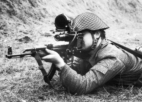 partisan1943: East German soldier firing a scoped AK-47.